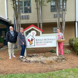 Shown delivering a donation and snacks for families to the two-story Ronald McDonald home are (l to r) Chris Kennedy of Clinton, who is the house manager, and Le Bonté club members Carol Pate and Janie Fields.