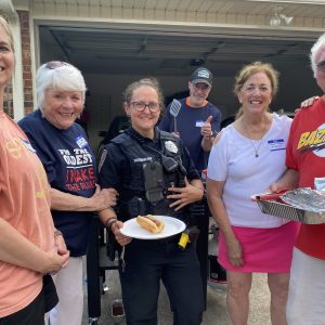 Residents welcoming Beth Victoriano of the Clinton Police Department to an Oakleigh Subdivision Block Party are (l to r) Stacy Ainsworth, Angie Abbott, Officer Victoriano, Jeff Ainsworth, Suzanne Pegues and Wes Pegues.