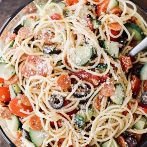 Spaghetti salad, full of chopped vegetables and tangy dressing, is the perfect hot-weather meal or side dish.