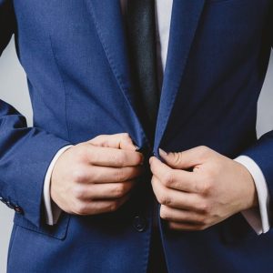 business man in suit button up