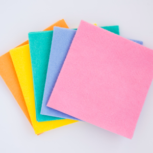 colorful paper in a stack on white background