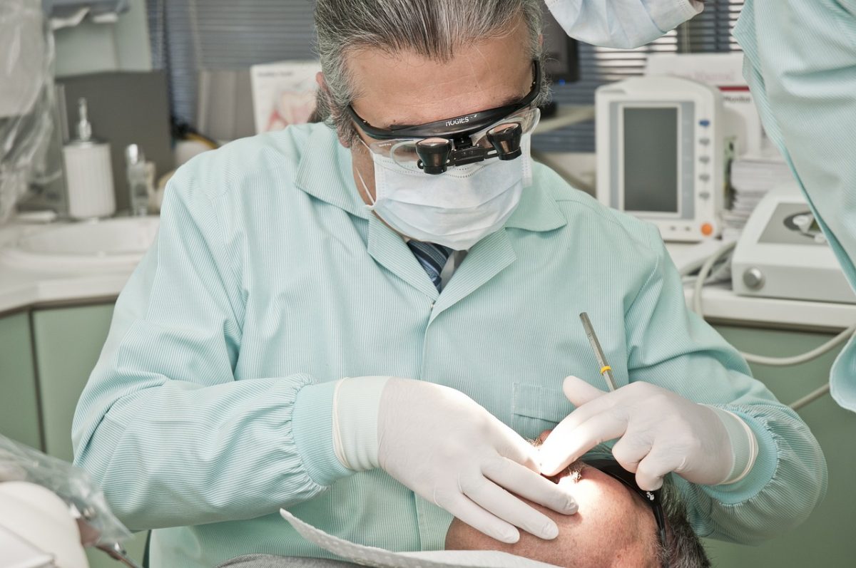 dentist checking a persons teeth