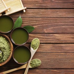 green paste on wooden background