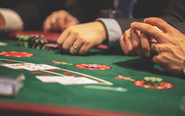 men at blackjack table