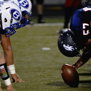 closeup of football players at line