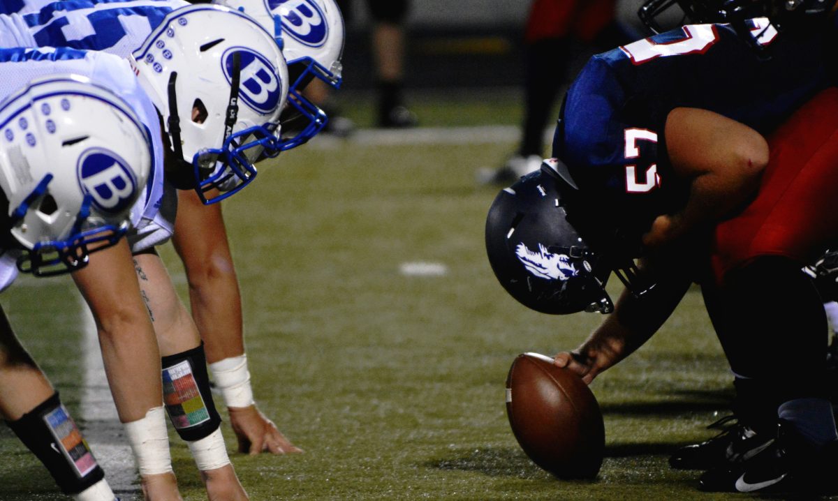 closeup of football players at line