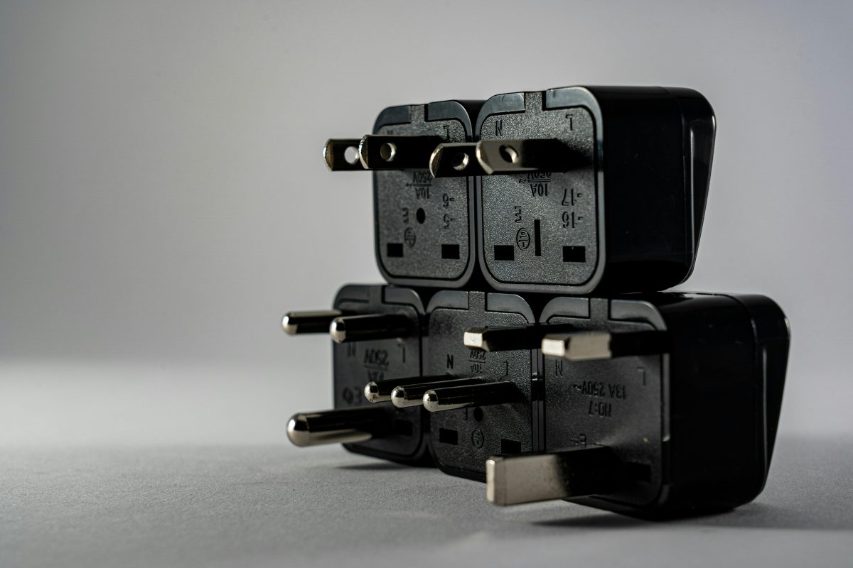 stack of black outlet plugs