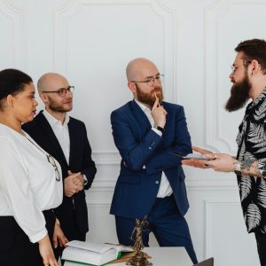 business professionals talk to client while standing