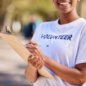 lady wearing a white shirt with volunteer written on it