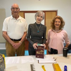 Stan Yeagley (left) is welcomed by Happy Gardeners Club hostesses Merrie Anderson (center) and Paula Wimbish (right) at the club’s March meeting, where he described the satisfaction and enjoyment in working with honey bees.