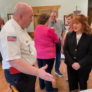 Blackledge chats with Alderwoman Beverly Olliver at his retirement reception.