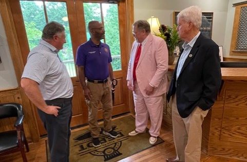 Outgoing Mayor Phil Fisher greets guests at his retirement reception June 19 at the Olde Towne Depot, which is being named for him.