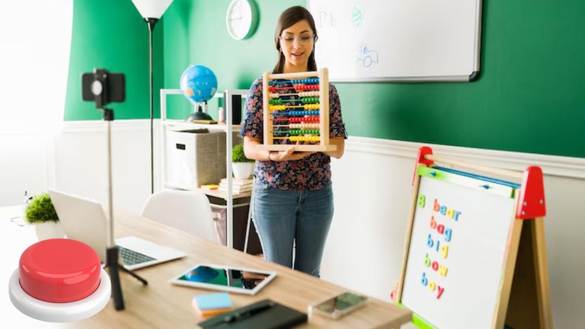 teacher holding a sound board near desk