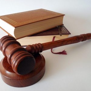 gavel on a desk with books