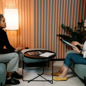 recruiter sits with applicant for job interview