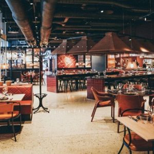 A restaurant with tables and chairs