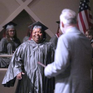 Nora Alexander of Clinton walks up to accept her certificate from Hinds Community College President Dr. Stephen Vacik.