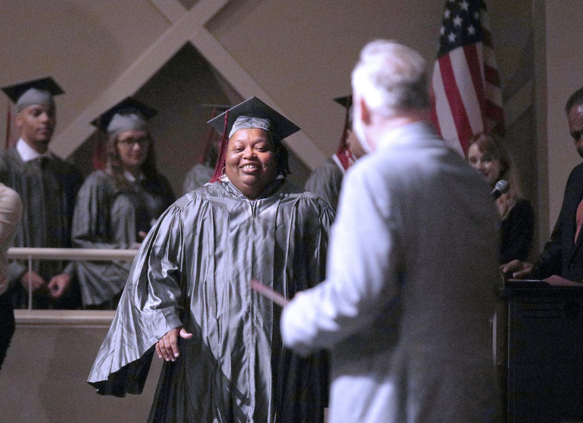 Nora Alexander of Clinton walks up to accept her certificate from Hinds Community College President Dr. Stephen Vacik.