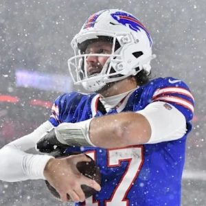 Josh Allen Bills Football hugs the football in the snow