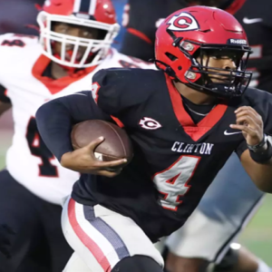Clinton Arrow Football player running the ball