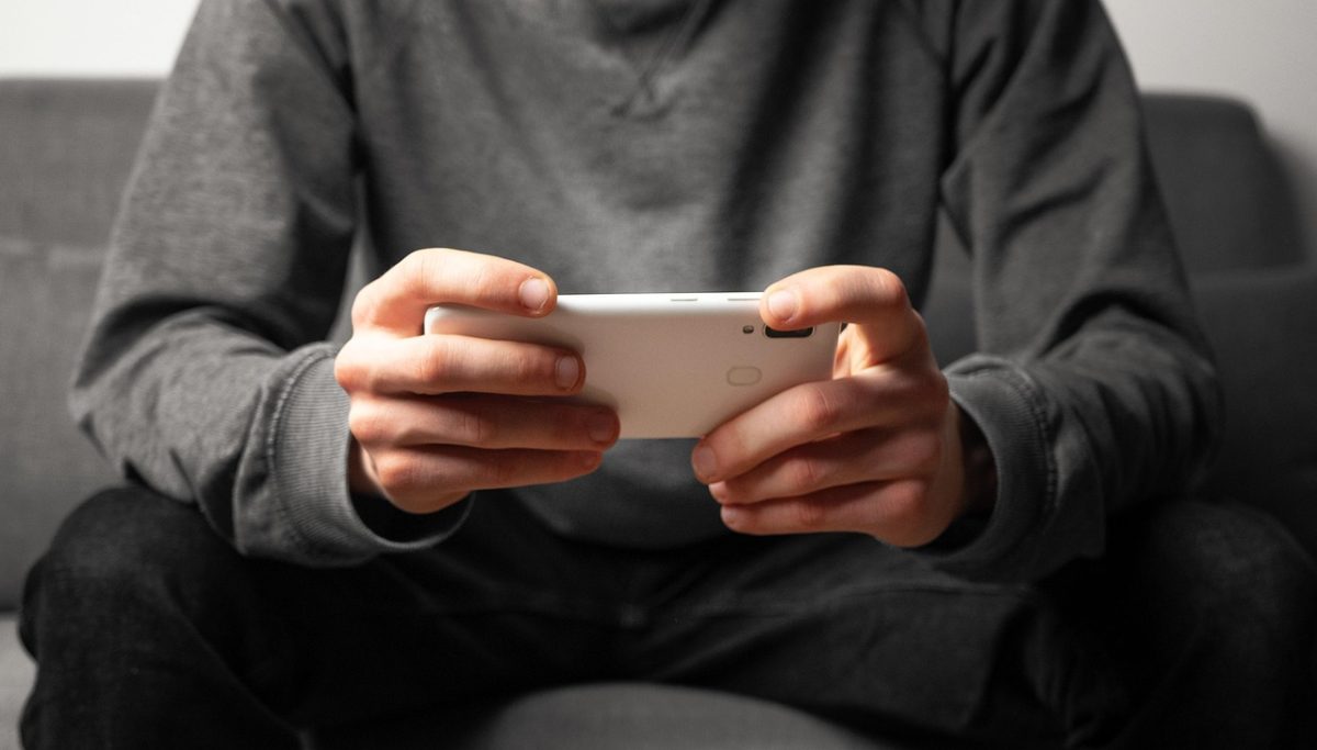 man holding phone.