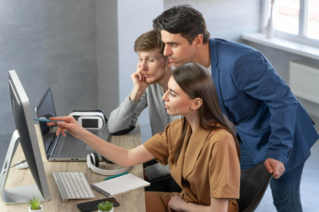 office professionals looking at a computer screen