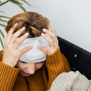Photo by Photo By: Kaboompics.com: https://www.pexels.com/photo/photograph-of-a-woman-with-a-headache-5207232/