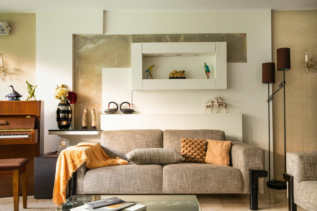 gray couch with throw pillows