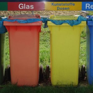 line of colorful garbage cans