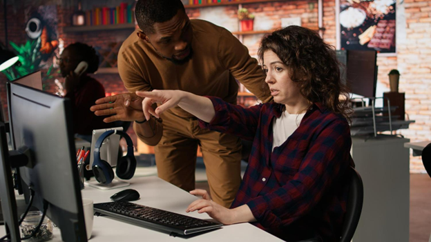 woman pointing at a computer screen