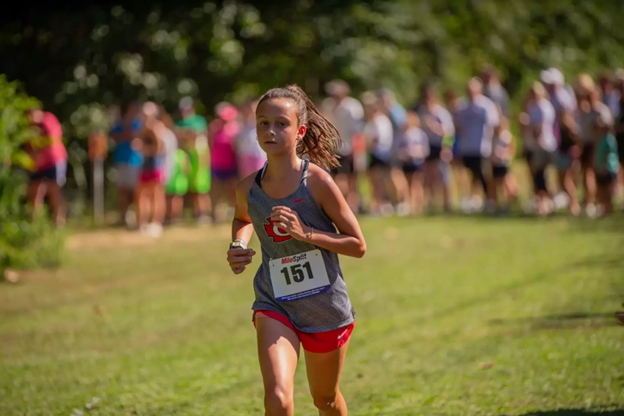 Clinton Arrows girls cross country running a race