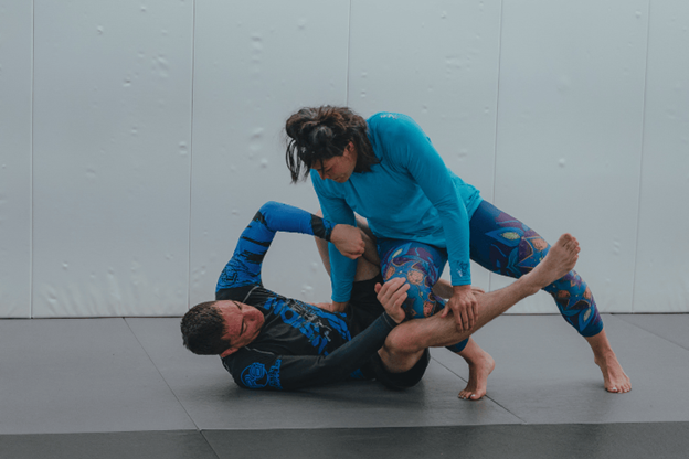 a person holding another person in a blue shirt