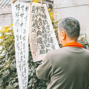 japanese man reading sign