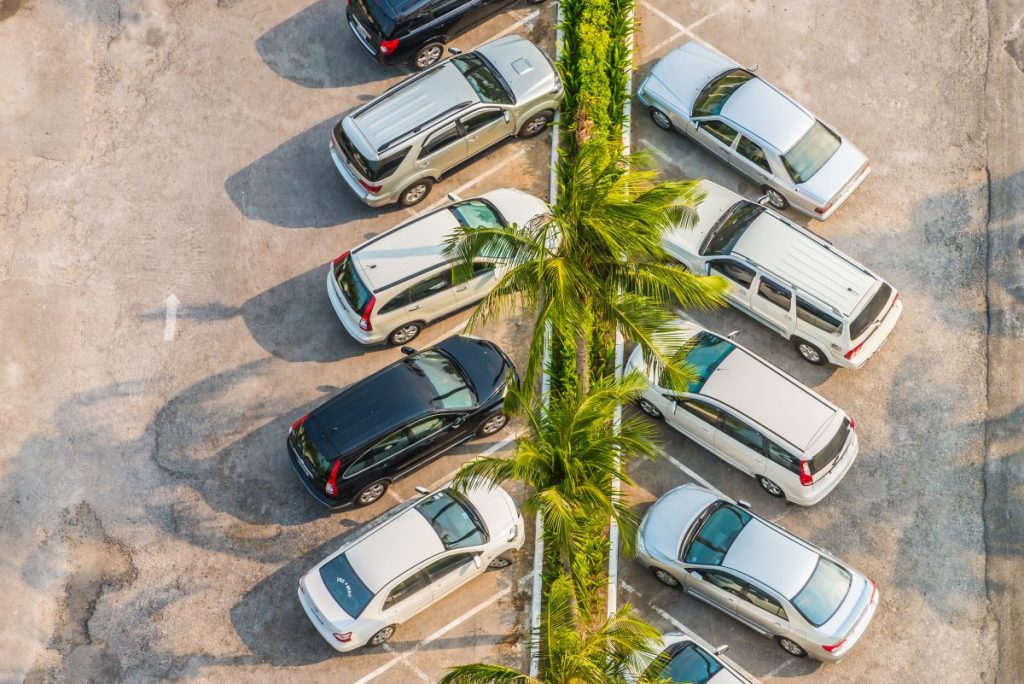 sky view of cars in a parking lot