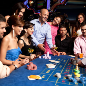 a group of people sitting around a casino table