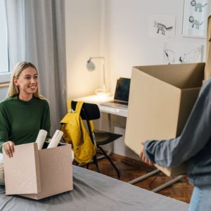 college students with moving boxes