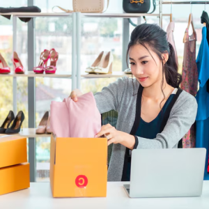 a person opening a box with clothes