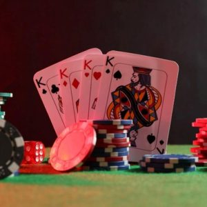 four kings with poker chips