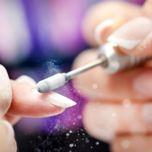 a person using a small tool to remove a nail