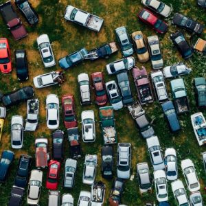 cars sitting in a junk yard sky view