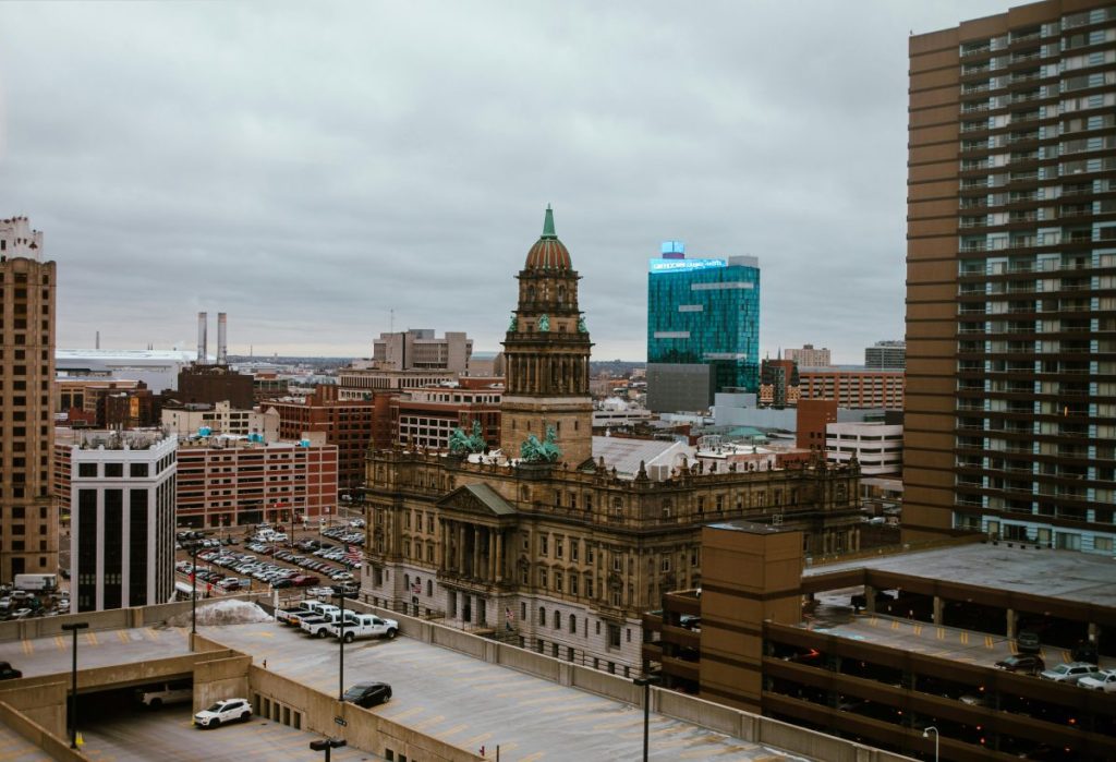 city buildings under a cloudy sky