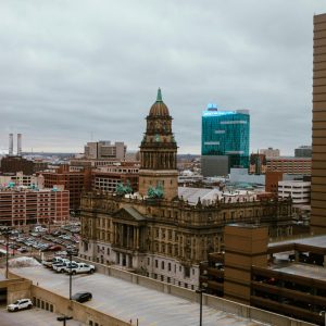 city buildings under a cloudy sky