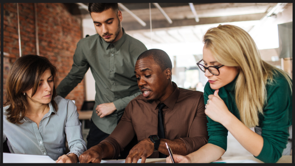 Team of employees working together in the office