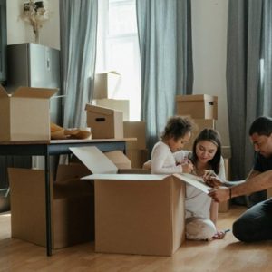 family packing after they buy homes in small Mississippi towns