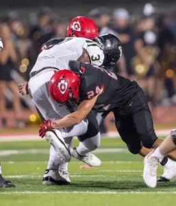 Robsen Neblett making a tackle