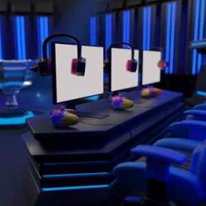 gaming computers with headphones and chairs