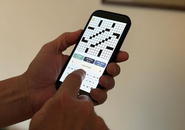 close up of phone with crossword puzzle
