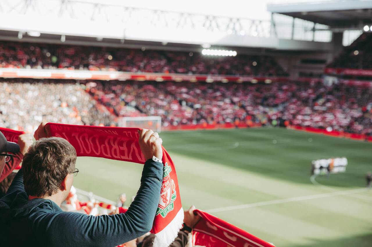 close up of someone holding a banner at a soccer game