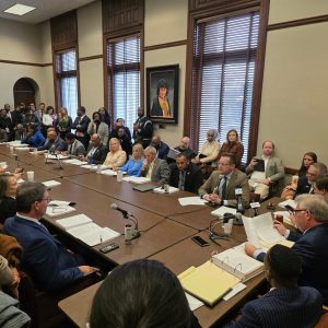 MC President Blake Thompson, center, congratulates outgoing members of the MC Board of Trustees on their service: from left, Ralph Barnes, Dr. Ronnie Falvey, Roy Fountain, and Rev. Hugh Plunkett.