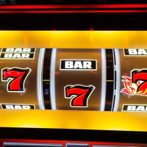 casino slot machine showing three 7's.